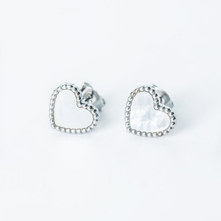 Lisa silver stud earrings with open heart design and textured edges