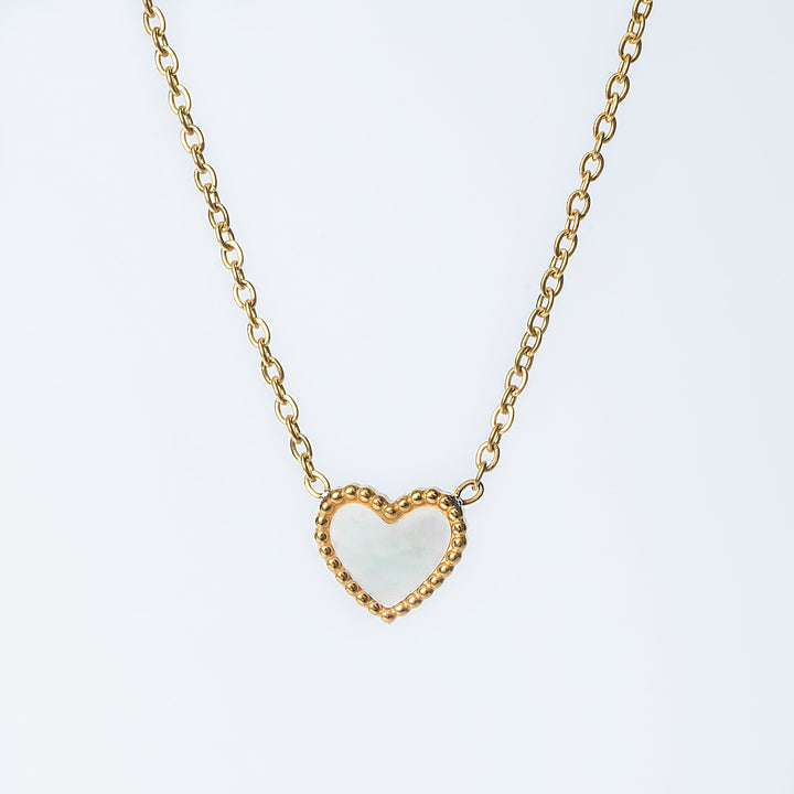 Lisa gold necklace with an open heart pendant on a fine chain