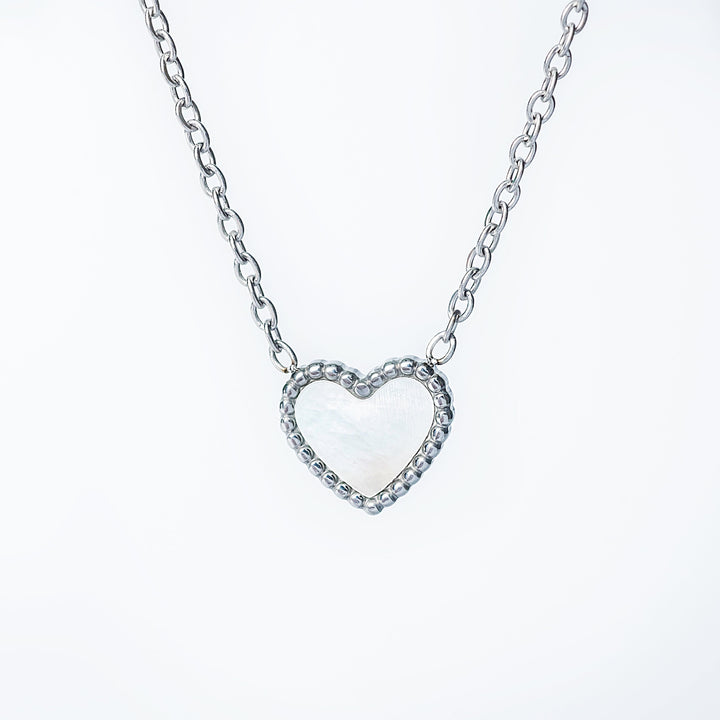 Lisa silver necklace with an open heart pendant on a fine chain