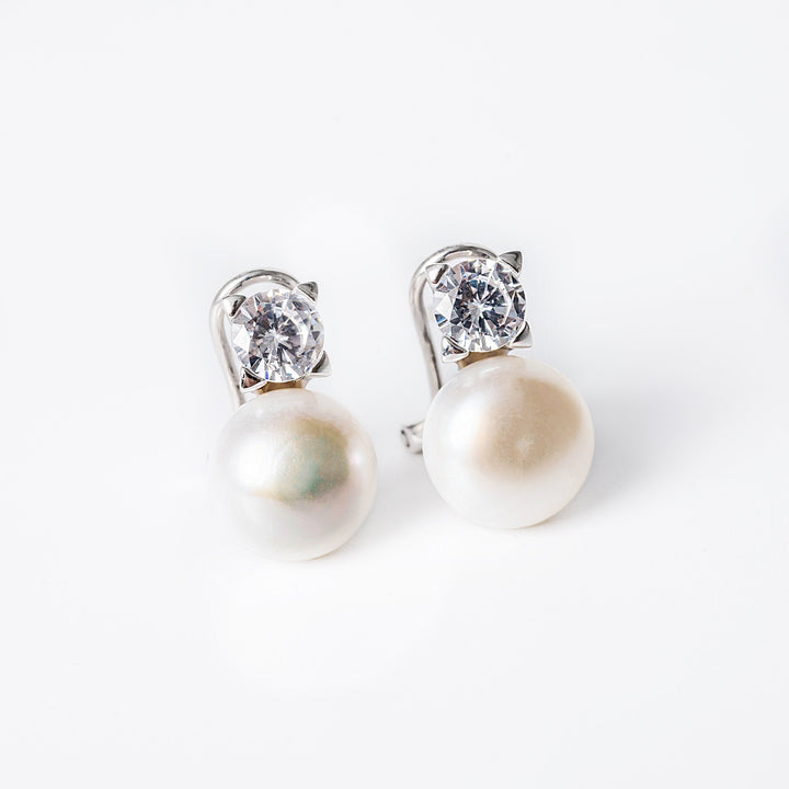 A close up view of Logan Earrings standing against a white background. 