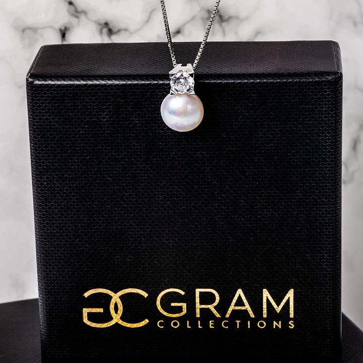 logan necklace standing on its box. 