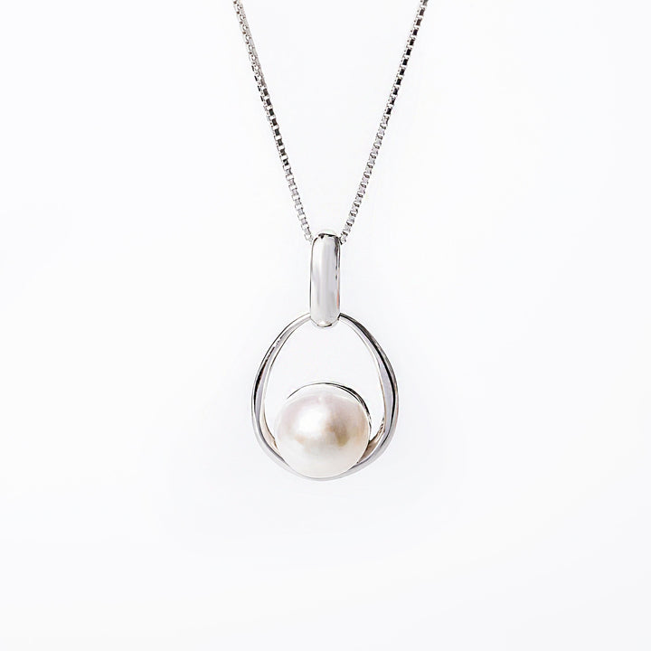 A silver Lola necklace featuring a single pearl and a small cubic zirconia gemstone, with a chain included.