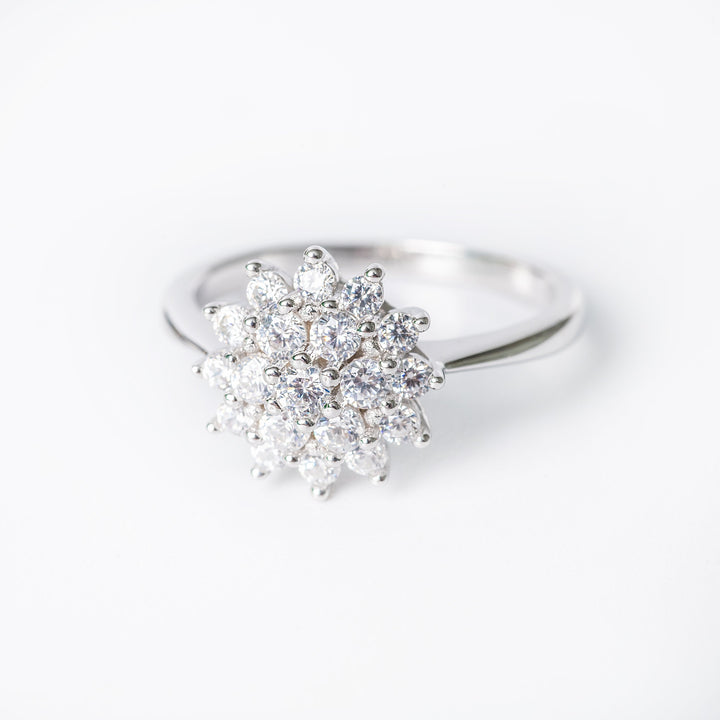 Lone ring close up view, standing in the center of the image against a white background. 