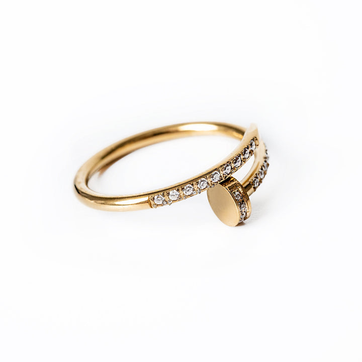 A close up view of Lorna Gold Ring standing in the center of the image against a white background. 