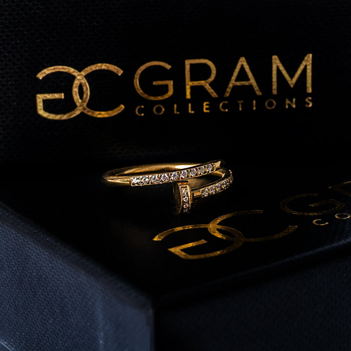 Close up view of Lorna Gold Ring standing in the center of its box. 
