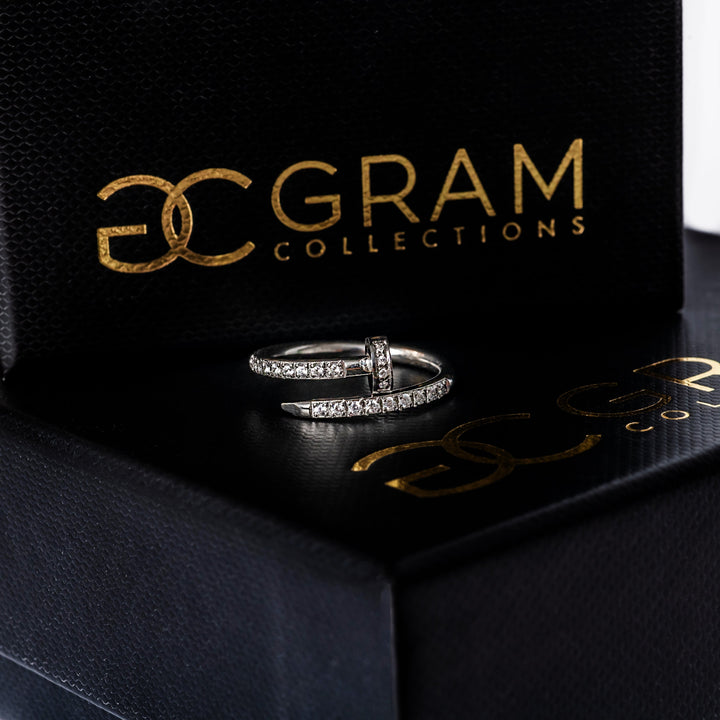 A close up view of Lorna Silver Ring standing on its uniquely designed box. 
