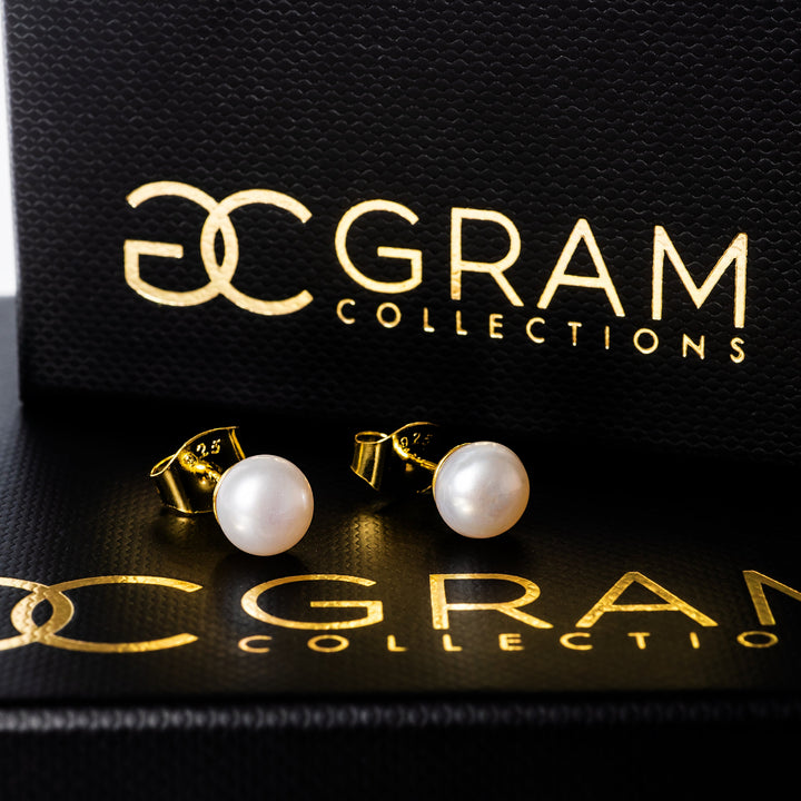 Louana Earrings standing on their uniquely made box. 