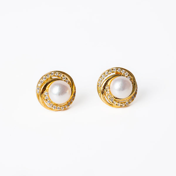 A pair of sterling silver hoop  Louanne earrings with yellow gold color and adorned with AAA cubic zirconia and cultured pearls.