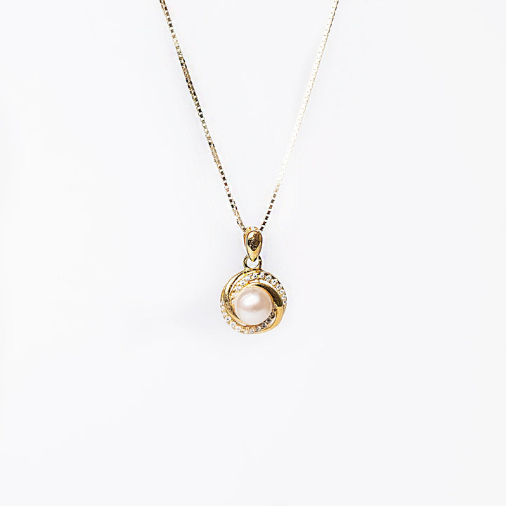 A close up view of Louanne Necklace standing against a white background. 