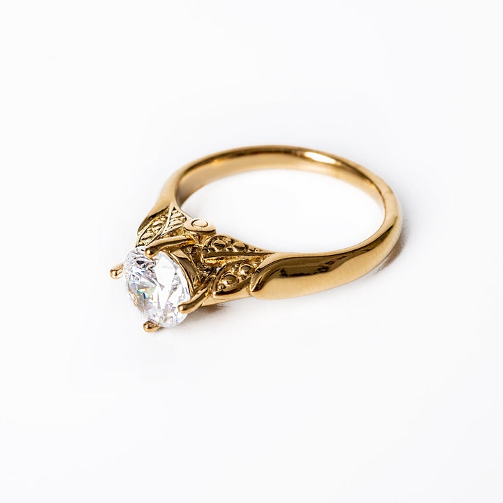 A profile view of Louise Gold Ring while standing in the center of the image against a white background. 