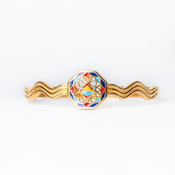 Decorative Luzzu bracelet with a colorful geometric design on a white background