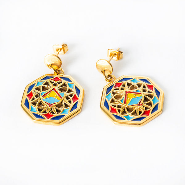 Luzzu earrings with colorful geometric design on a white background