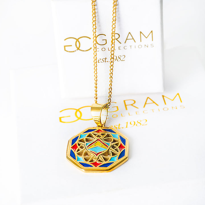 Gold Luzzu necklace with a colorful pendant on a white background with 'OC Gram' branding.