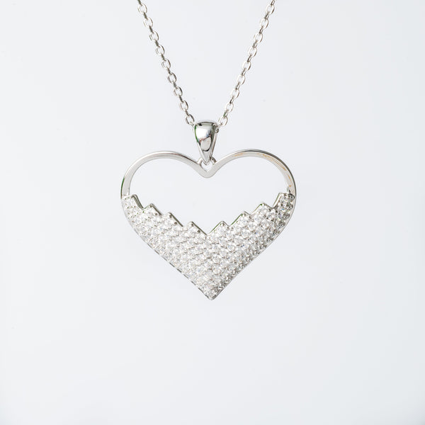 Lyn.necklace with a heart-shaped pendant featuring a cubic zirconia gemstone.