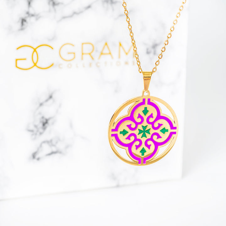 Maduma necklace with a colorful pendant on a marble background