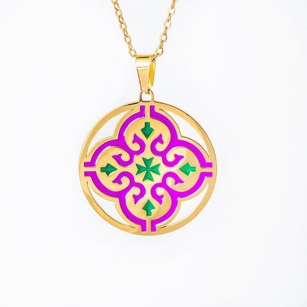 maduma necklace with a circular pendant featuring purple and green patterns on a white background