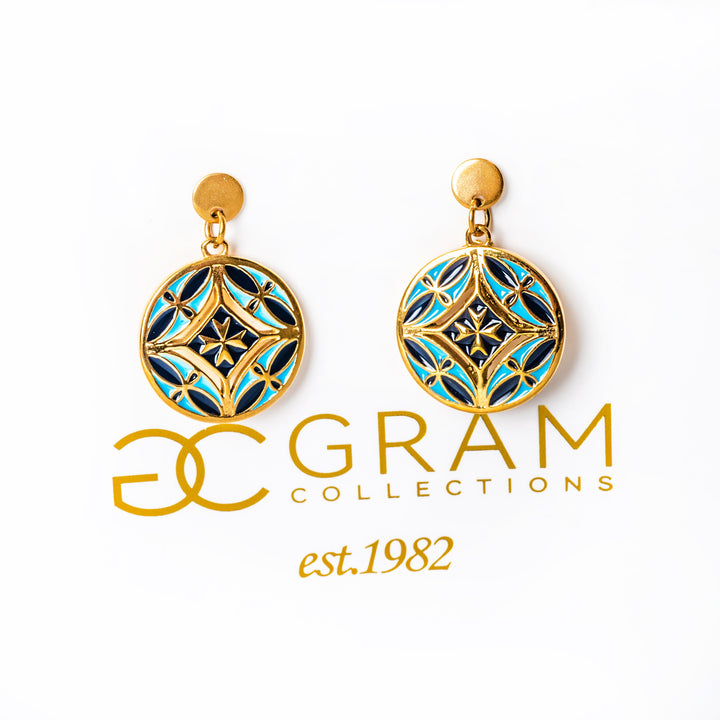 Gold and blue Malta earrings with Gram Collections logo on a white background og gram collections box. 