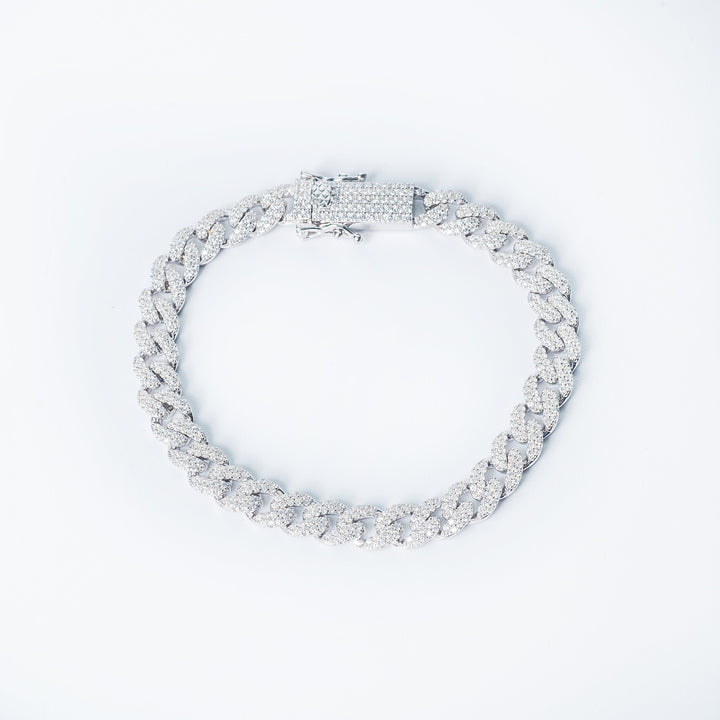 Silver Manchester bracelet with pavé-set chain links and a stone-embellished clasp photographed from a top view on a white background