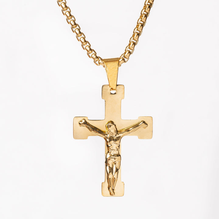 A close up view of Manly Cross Gold Necklace