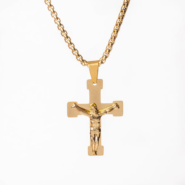 A gold-plated stainless steel cross necklace with a chain and a pendant.