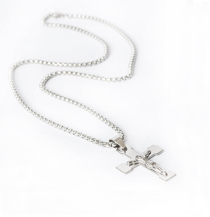 A side view of Manly Cross Silver Necklace.