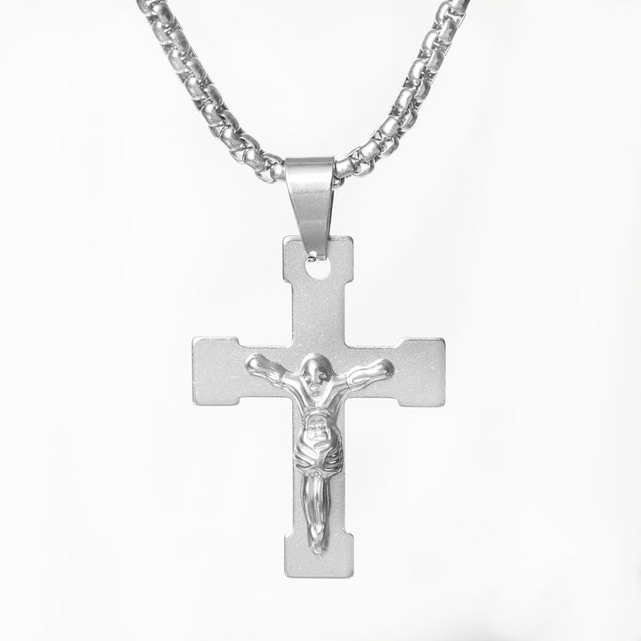 Silver crucifix pendant necklace on a white background