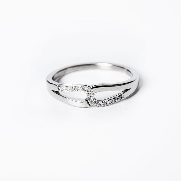 A silver-colored  Marianne ring with gold plating and adorned with cubic zirconia gems.