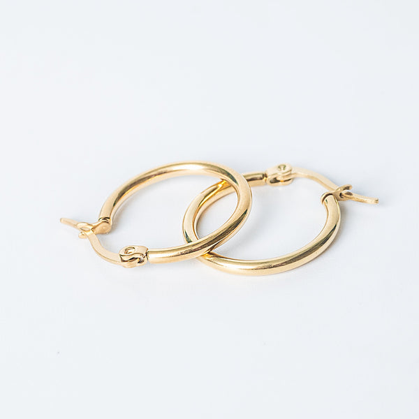 Gold Marion hoop earrings on a white background