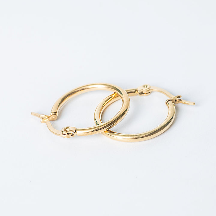 Gold Marion hoop earrings on a white background