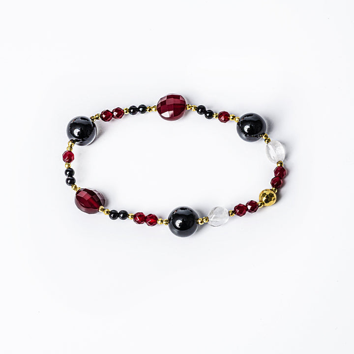 a bird view of a Maroon Bracelet standing in the center of the image against a white background. 