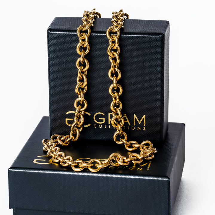 Marta Necklace placed on its box, standing in the center of the image 
