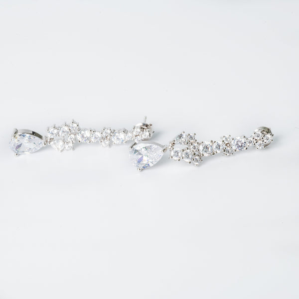 A pair of sterling silver melissa hoop earrings with AAA cubic zirconia embellishments.