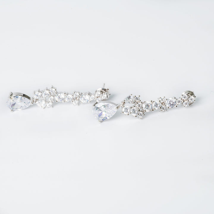 A pair of sterling silver melissa hoop earrings with AAA cubic zirconia embellishments.