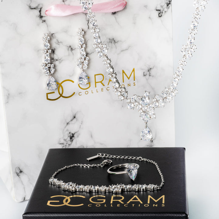 Melissa Necklace placed on its white and black boxes 