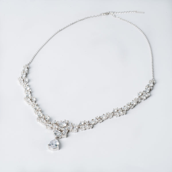 Melissa necklace featuring a series of round charms with cubic zirconia centers, displayed against a white background.