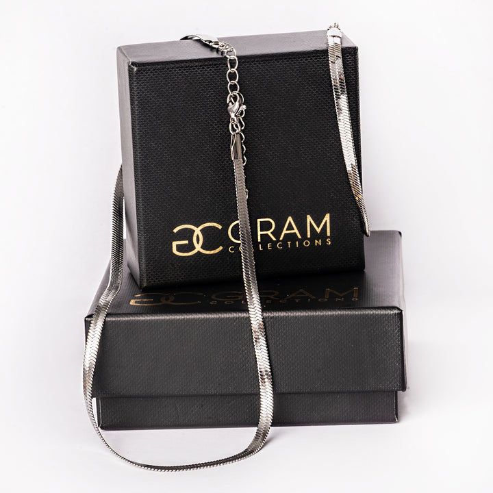 Messina Bracelet placed on its box, and standing in the center of the image. 