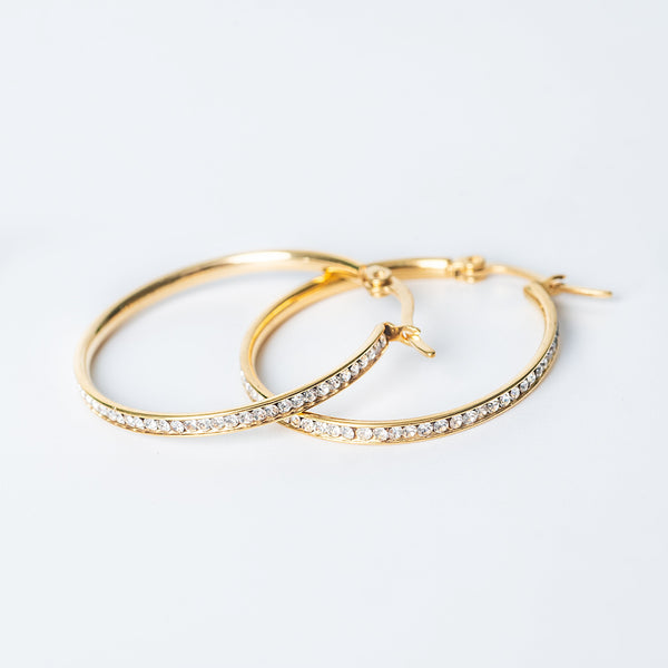 Mica gold hoop earrings lined with clear crystals