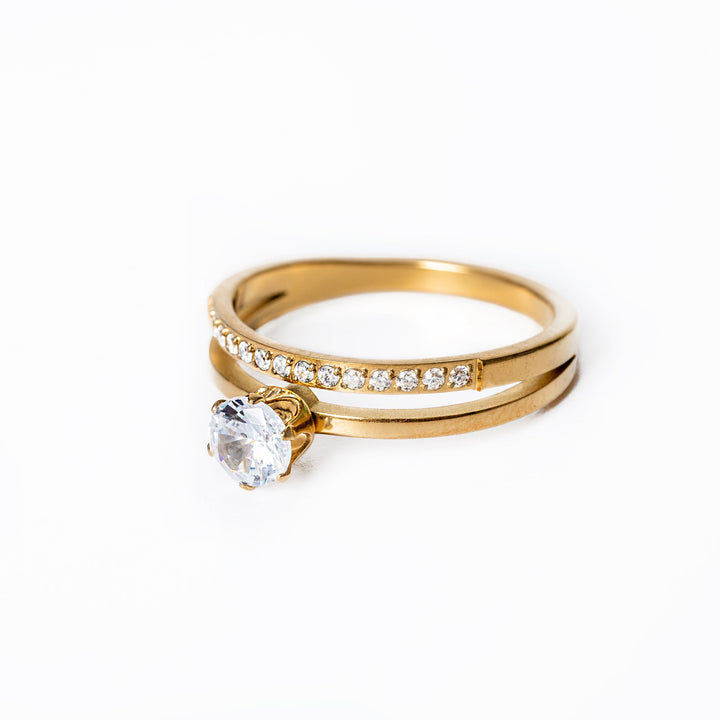 Michela Gold Ring standing in the center of the image against a white background 