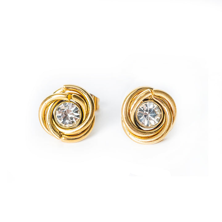 Gold knot-style stud earrings with a clear round crystal in the center