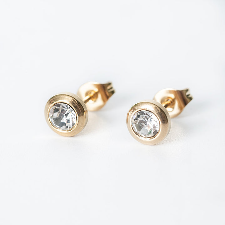Gold Mirielle stud earrings with bezel set clear crystals