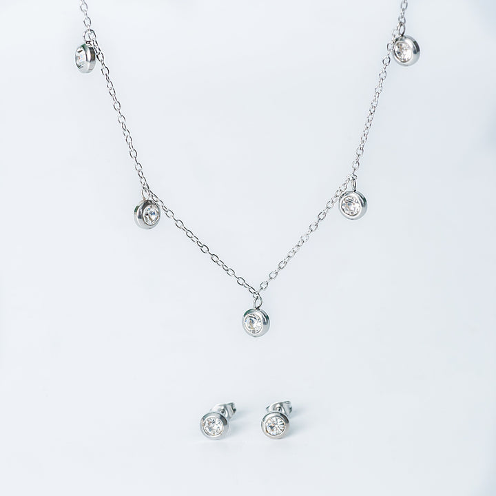 Silver Mirielle jewelry set with a dangling crystal necklace and matching crystal stud earrings