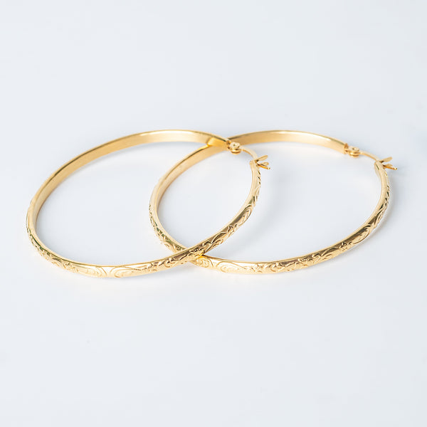 Molly gold hoop earrings with engraved pattern