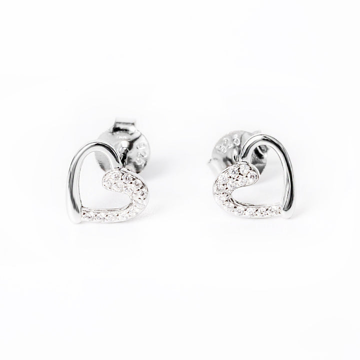 A close up view of Naomi earrings standing in the center of the image against a white background. 