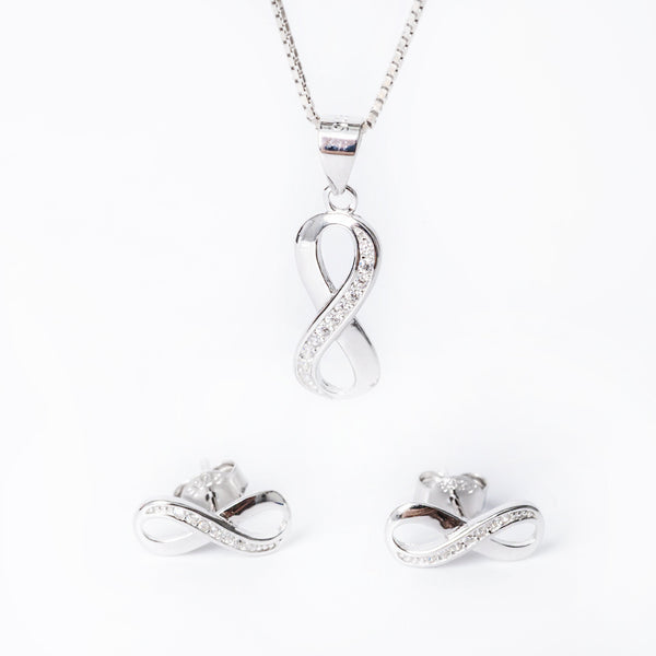 A sterling silver jewelry Nicolette set including a pendant, chain, and earrings with cubic zirconia accents.