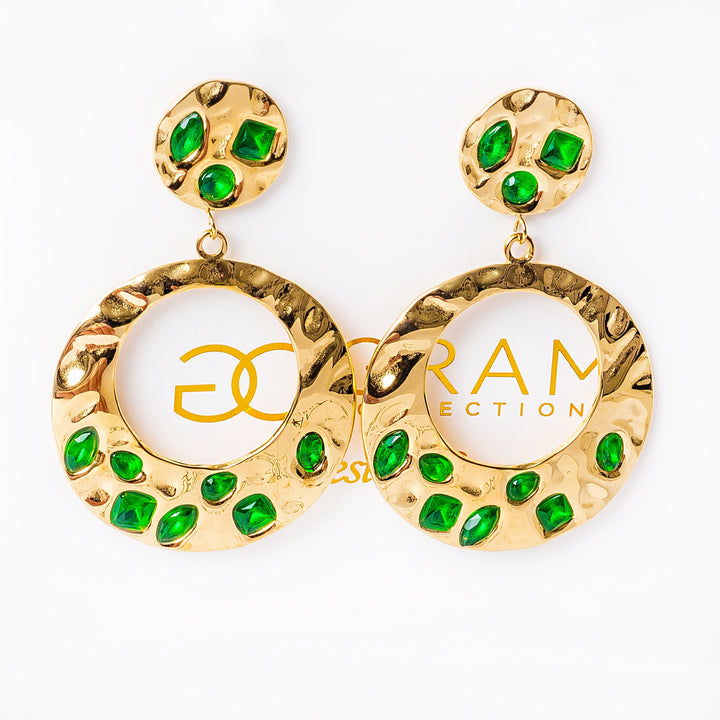 A close up view of Nova earrings standing in the center of the image against a white background. 