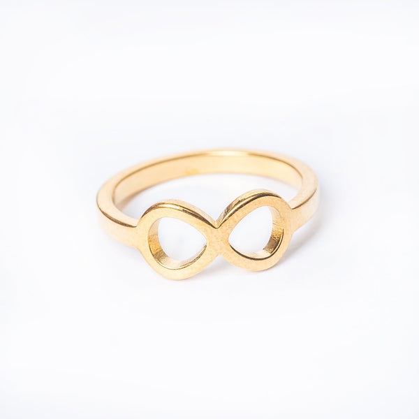 A close up view of Orchid ring standing in the center of the image against a white background. 