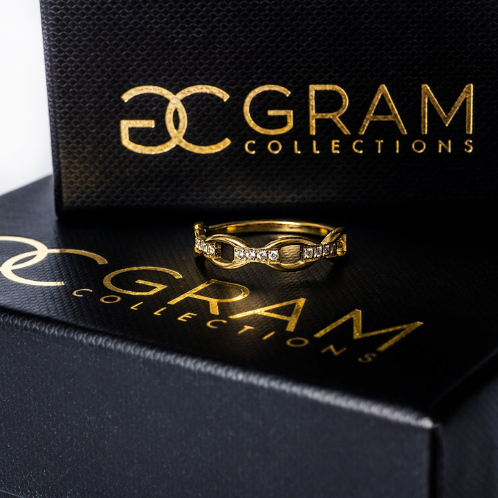 Pamela Gold Ring placed on its uniquely designed gram collections box. 