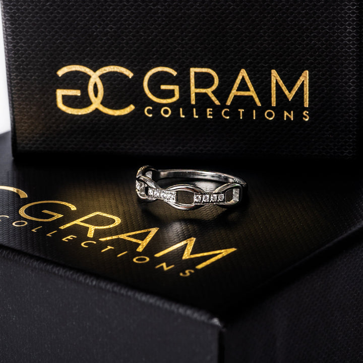 Pamela silver ring standing on its box. 