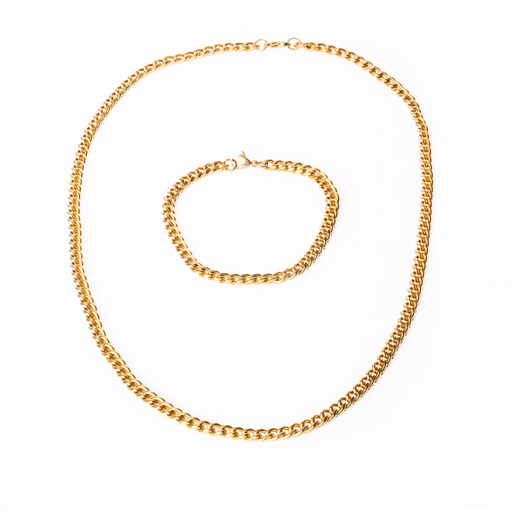 A close up view of gold bracelet standing in the center of the image. 