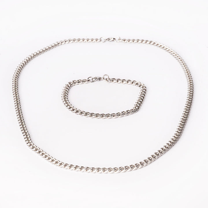 Parma silver necklace standing in the center of the image against a white background. 